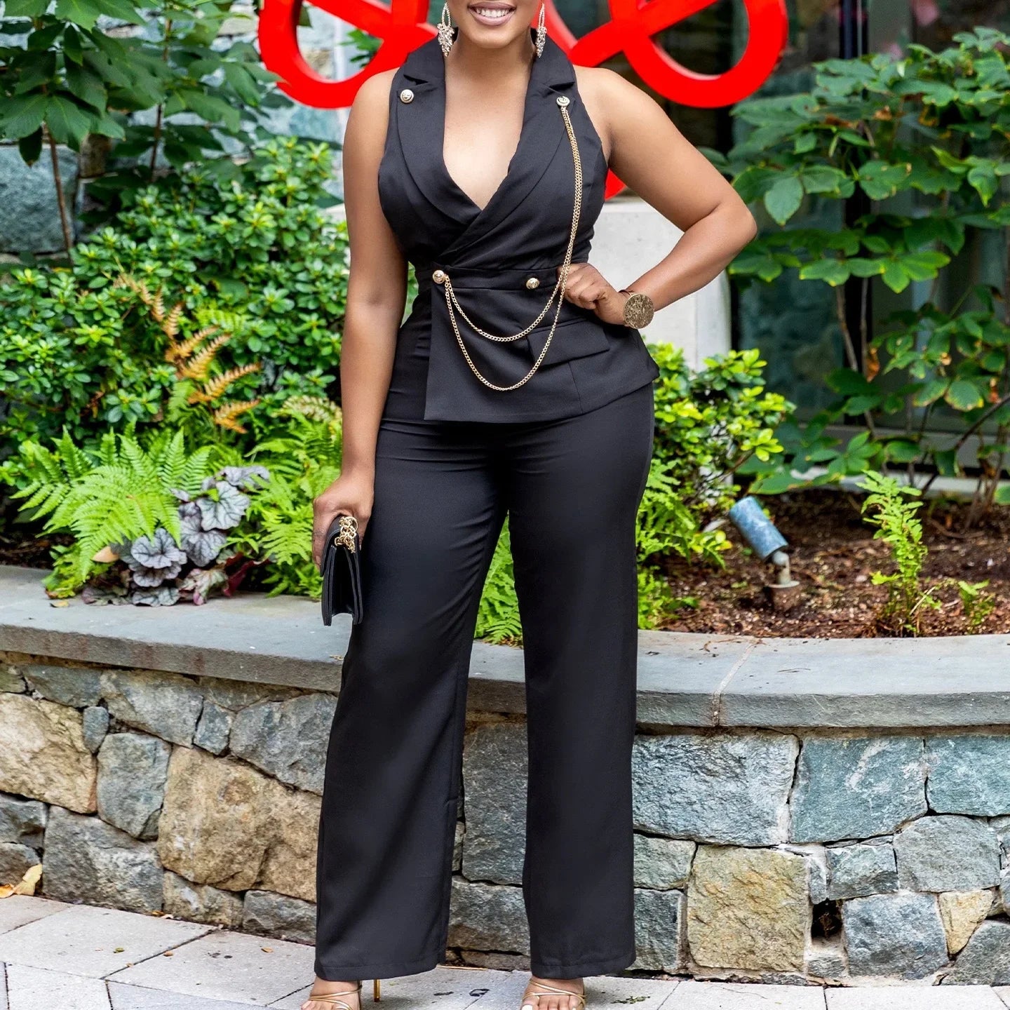 Elegant Sleeveless Jumpsuit for Women with Notched Collar Buttons and Chain Detail Luxury Solid Color Romper for Birthday Party and Special Occasions