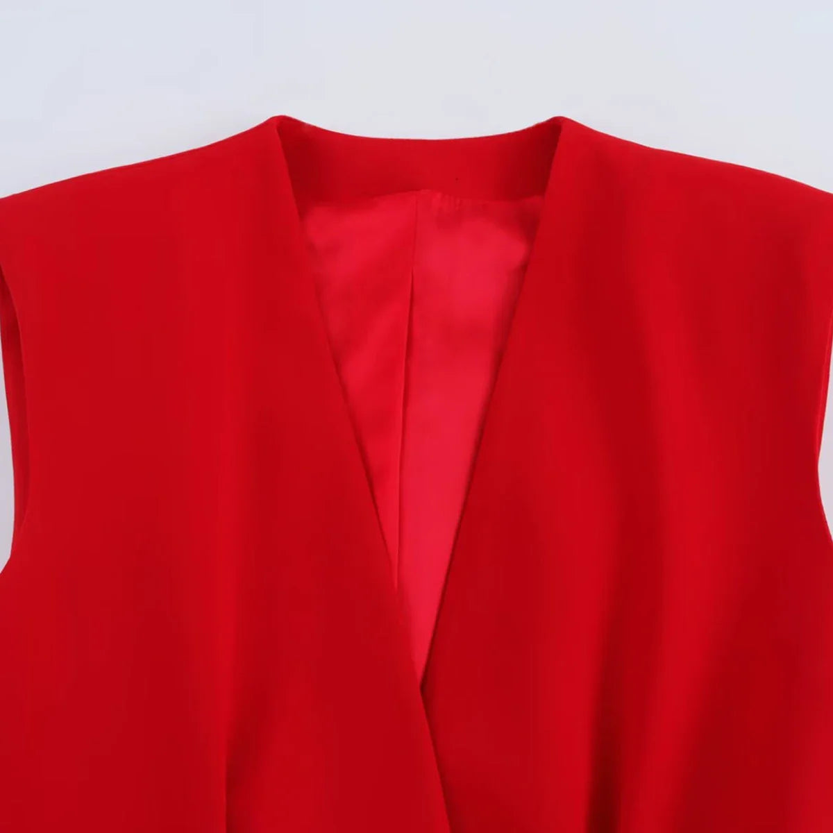 Women's Belted V-neck Vest Top with Shoulder Pads and Pockets Paired with Flared Pants for Casual Spring Summer Chic Look