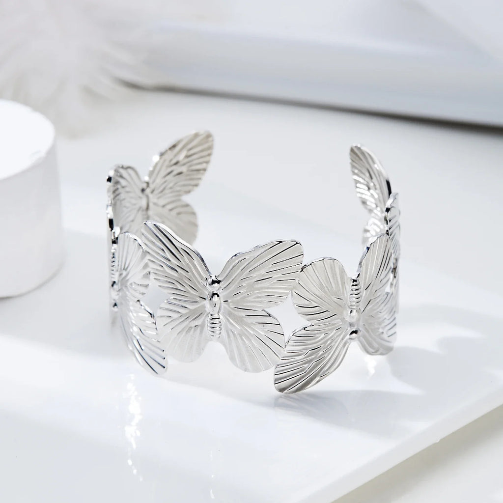 Gold Plated Adjustable Cuff Bracelet with Hollow Flower Butterfly Design in High Quality Stainless Steel for Women Jewelry