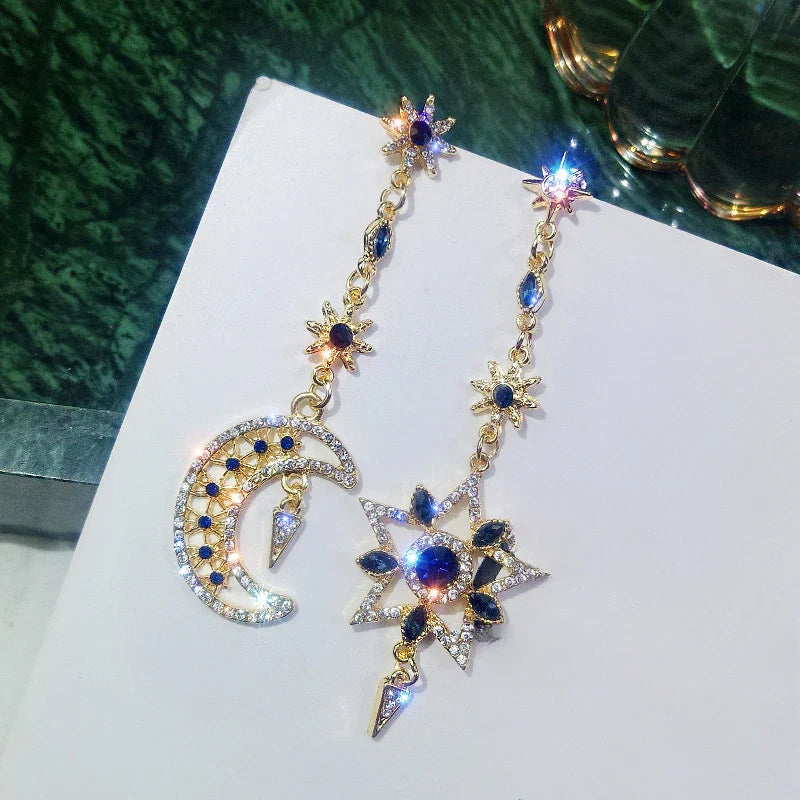 Elegant Silver Asymmetric Star Moon Earrings with Long Tassel Design and Sparkling Detail