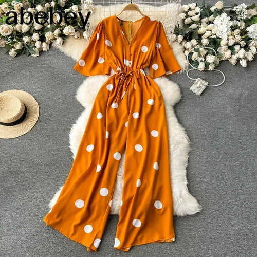 Women Wide Leg Polka Dot Jumpsuit with V Neck Dolman Sleeves and Slim Waist Design
