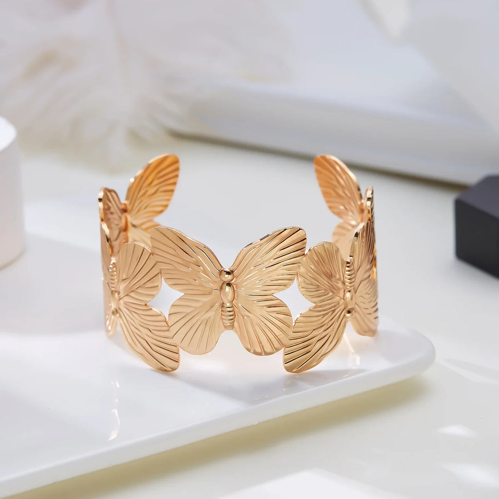 Gold Plated Adjustable Cuff Bracelet with Hollow Flower Butterfly Design in High Quality Stainless Steel for Women Jewelry