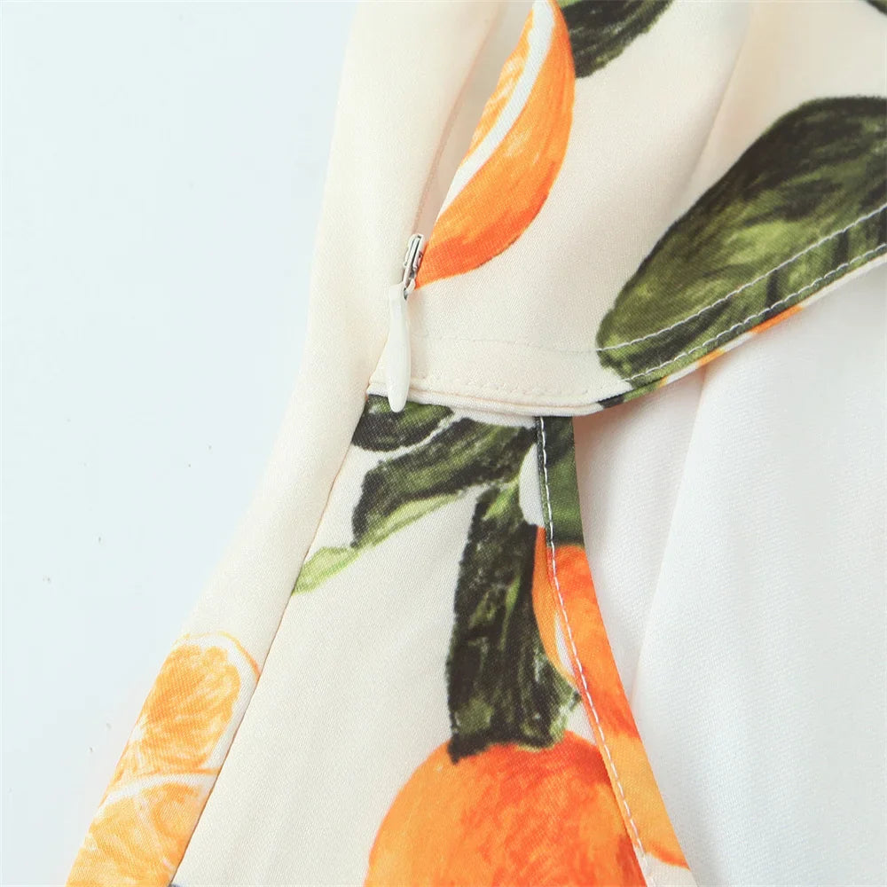 White Sleeveless Cross Back Dress With Orange Fruit Print