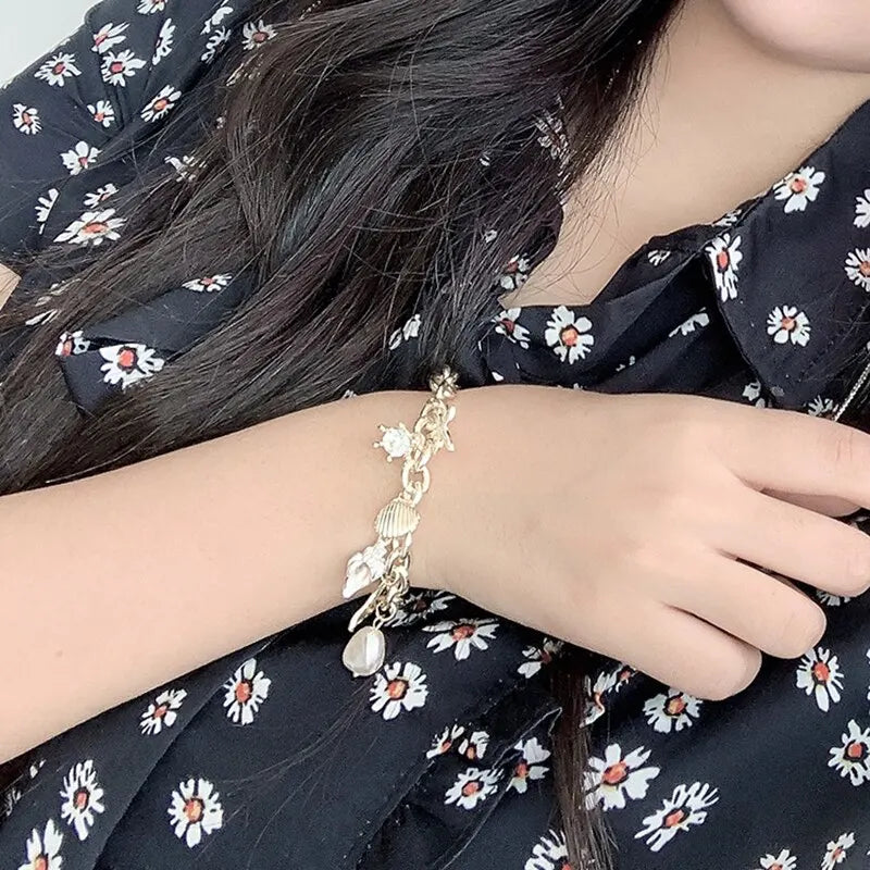 Starfish Shell Conch Bracelet with Imitation Pearl and Gold Color Chain for Women Ocean Inspired Summer Beach Jewelry