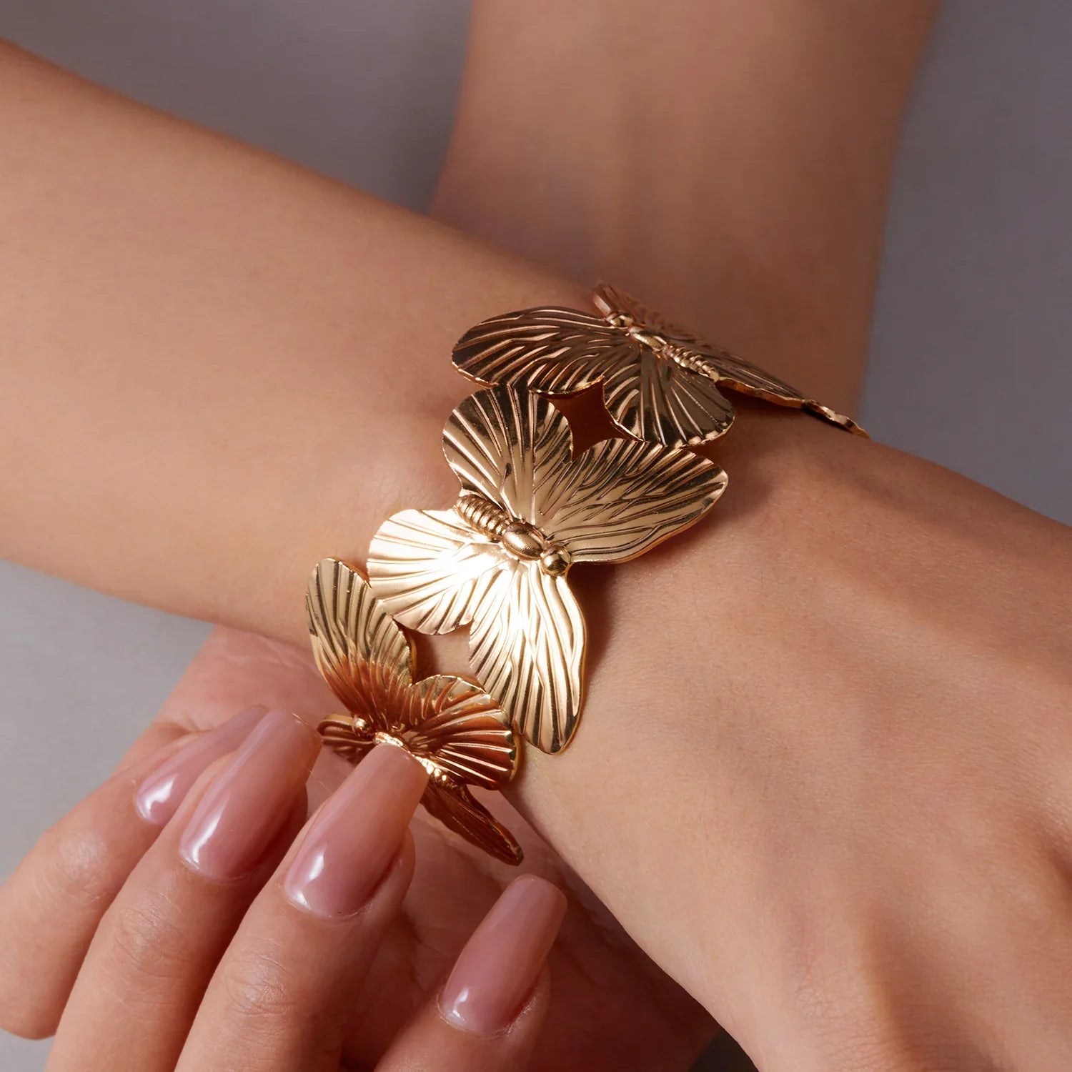 Gold Plated Adjustable Cuff Bracelet with Hollow Flower Butterfly Design in High Quality Stainless Steel for Women Jewelry