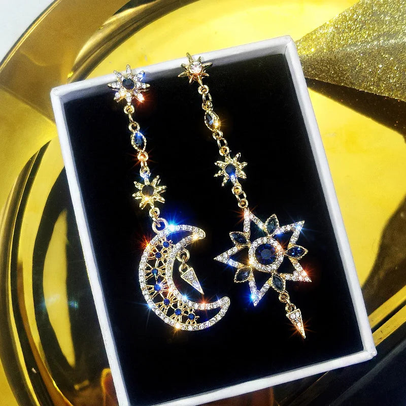 Elegant Silver Asymmetric Star Moon Earrings with Long Tassel Design and Sparkling Detail
