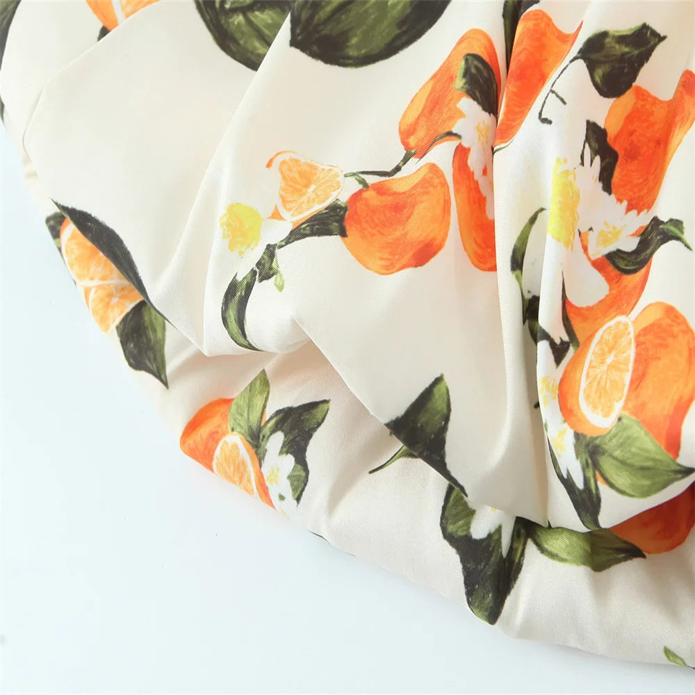 White Sleeveless Cross Back Dress With Orange Fruit Print