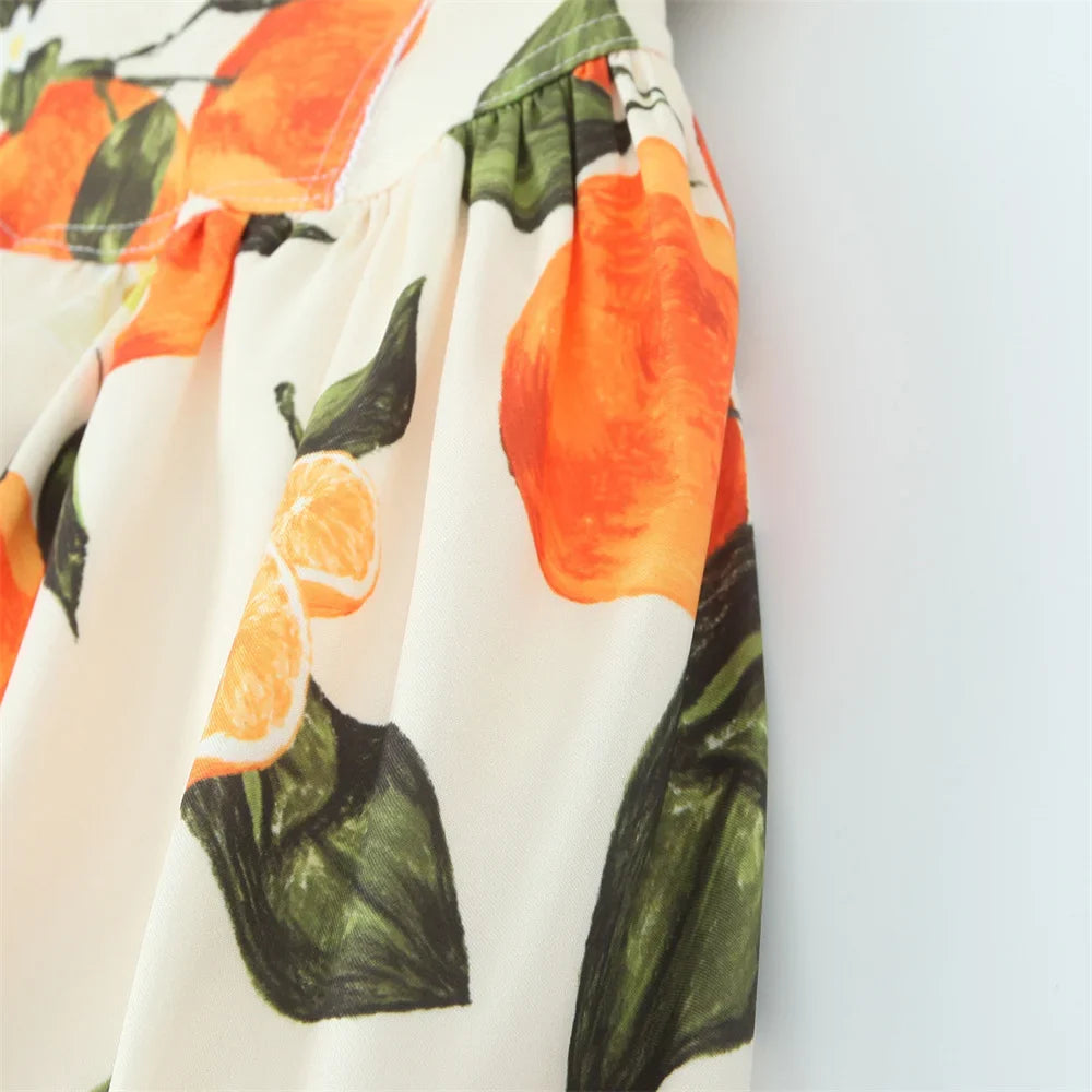 White Sleeveless Cross Back Dress With Orange Fruit Print