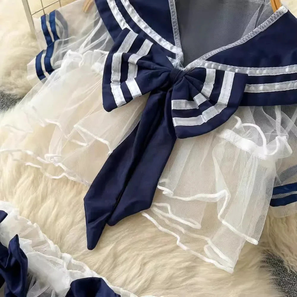 Women's Sexy Transparent Sailor Student Uniform Cosplay Costume Sheer Bowknot Stripe Patchwork Top with Mini Skirt Two-Piece Set