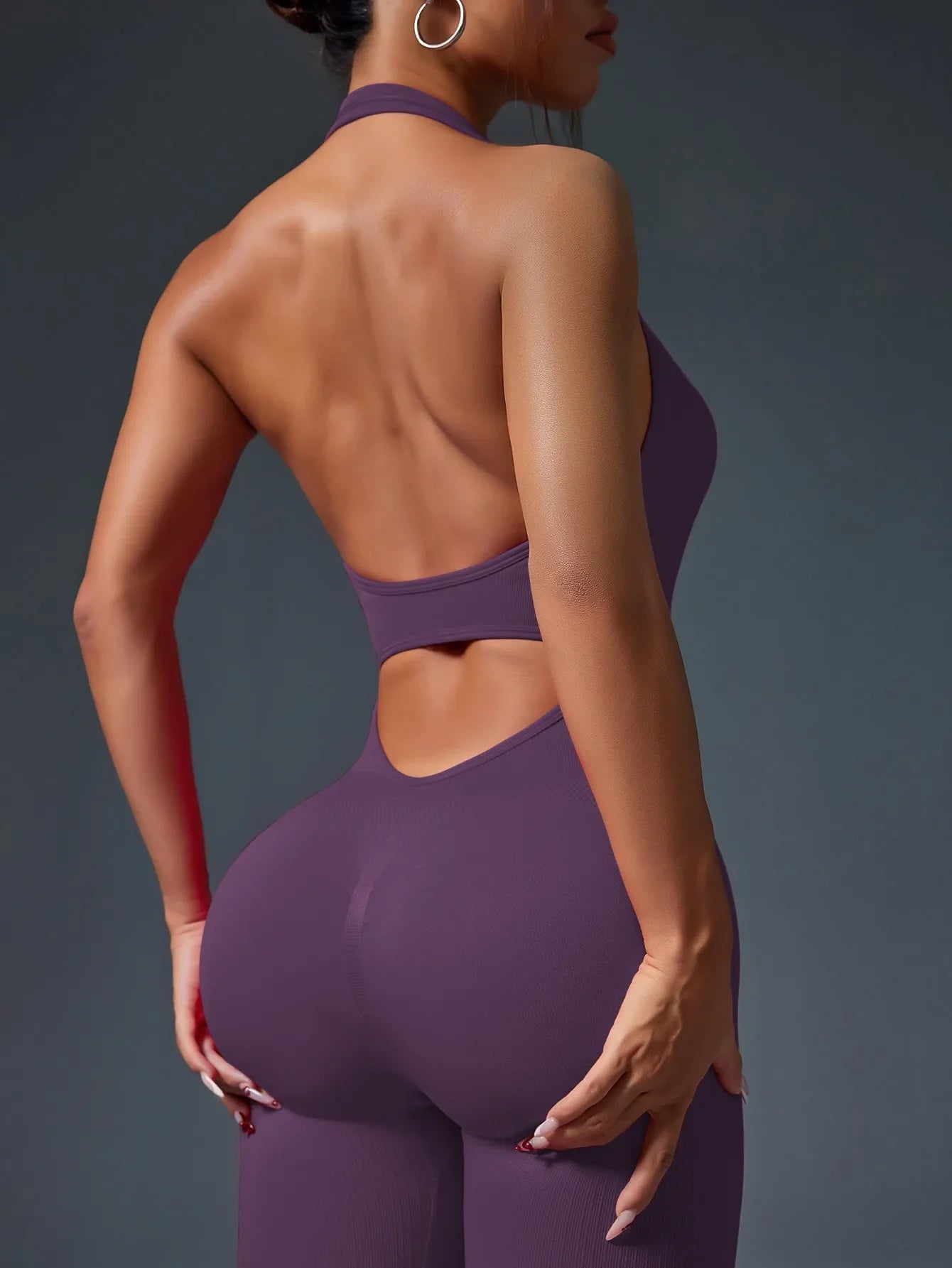 Women's Purple Ribbed Backless Hanging Neck Yoga Jumpsuit Tailored Fit for Body Contouring and Comfort